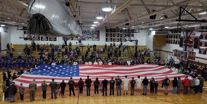 Despite the winter weather, approximately 100 veterans came out to Lockport Township High School’s east campus on Feb. 4, 2022, for the school’s annual Veterans Appreciation Night. Veterans and students together held the American flag while everyone who attended sang the National Anthem. Berlands of Joliet donated the large flag. Registration is now open for this year's event on Dec. 1.