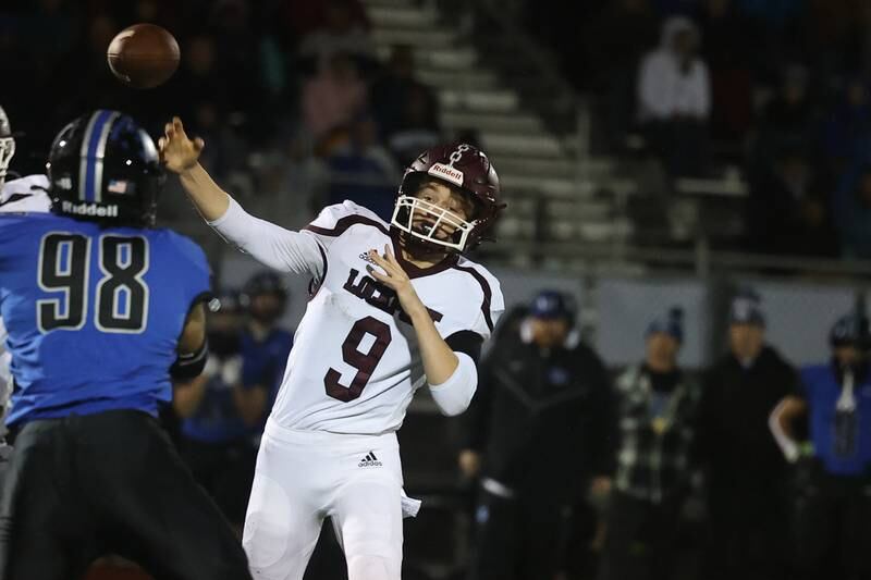 Lockport’s Brady Pfeiffer passes against Lincoln-Way East Friday night.