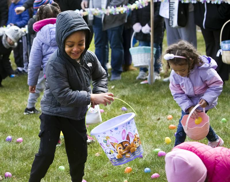 D.J. Green, 5, of Joliet, picks up candy filled eggs during Timbers of Shorewood Hippity-Hop Easter Egg Hunt Saturday, March 23, 2024, in Shorewood, Ill.