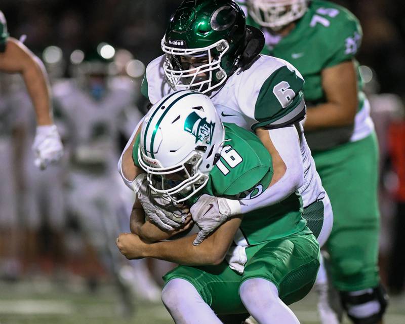 York's Zack Assaad (16) gets tackled by Glenbard West's Scott Segebarth (6) during the game on Friday Oct. 17, 2025, held at York High School.