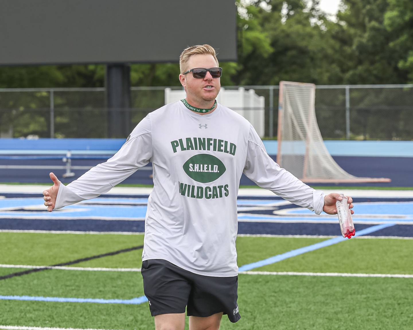 Plainfield Central's head coach Robby Carriger coaches up a player during the Downers Grove South 7 on 7 football tournament, July 12, 2025  in Downers Grove.