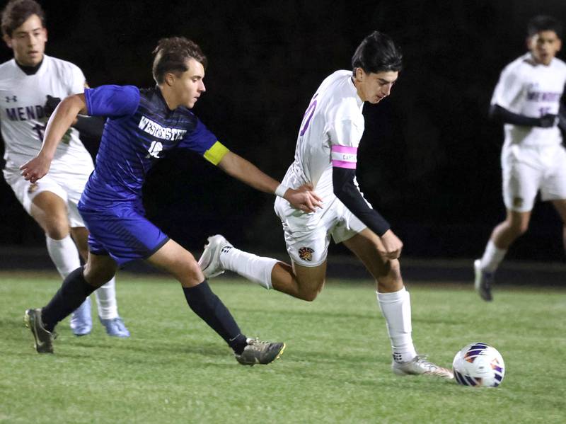 Mendota's Johan Cortez pushes the ball ahead of Harvest-Westminster's Heitor Bannwart Friday, Oct. 31, 2025, during the Class 1A Indian Creek Sectional championship game Friday in Waterman.