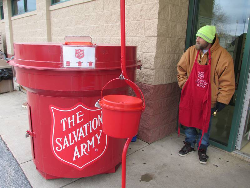 Jake Robinson rings a bell Saturday, Nov. 12, 2022, on the opening day of the Salvation Army's Red Kettle Drive at Handy Foods in Ottawa.
