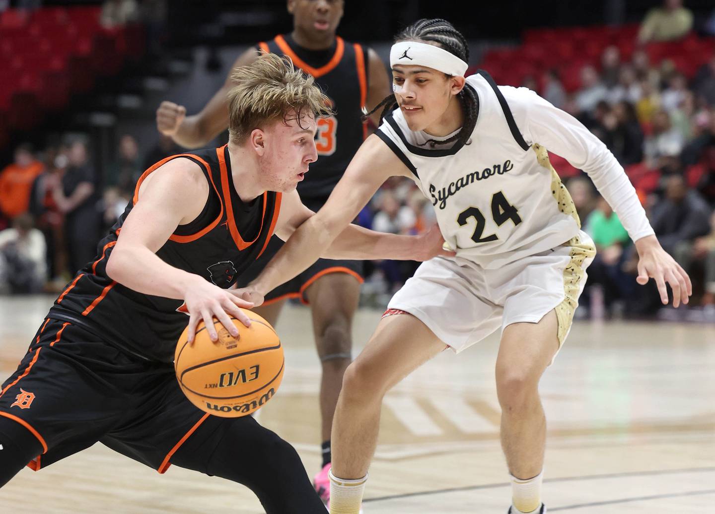 DeKalb's Sean Reynolds works against Sycamore's Unique Shaw during their game Friday, Jan. 31, 2025, in the FNBO Challenge in the Convocation Center at Northern Illinois University in DeKalb.