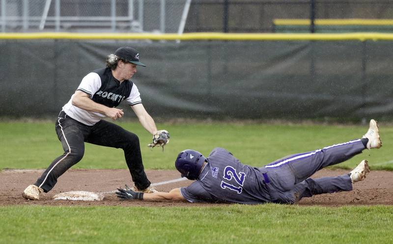 Dixon’s Gage Helfrich steals third as Rock Falls’ Carter Hunter is late on the tag Thursday, April 9, 2026.