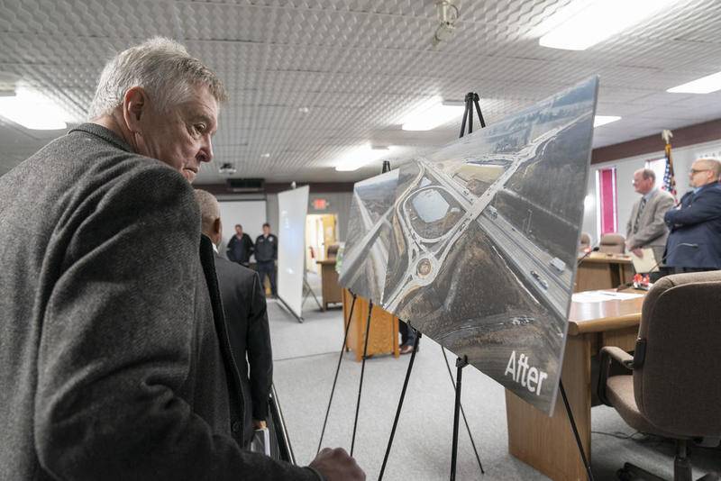Illinois state Rep. Steven Reick looks at before and after photos before a ceremony on Tuesday, Dec. 10, 2019, by the Illinois Tollway at the Marengo City Hall. Officials announced the opening of a new interchange at Route 23 and Interstate 90 in Marengo. The interchange is scheduled to open to traffic on Dec. 23. Ryan Rayburn for Shaw Media