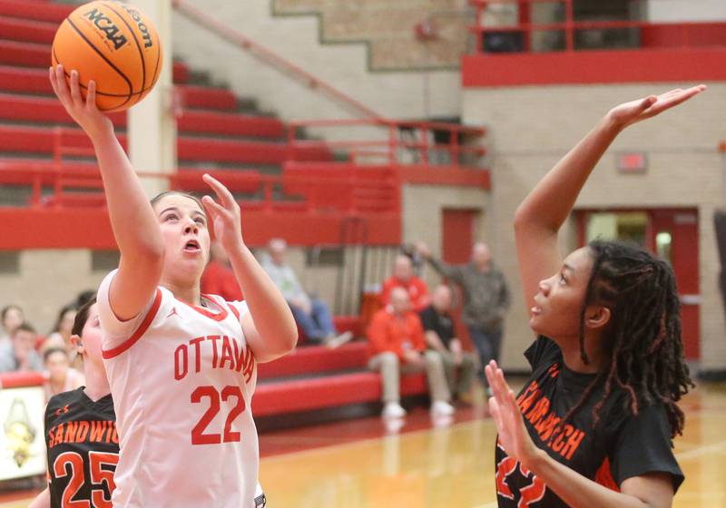 Ottawa's Marlie Orlandi eyes the hoop while taking a jump shot over Sandwich's Alaya Harris on Monday, Jan. 27, 2025 in Kingman Gym at Ottawa High School.