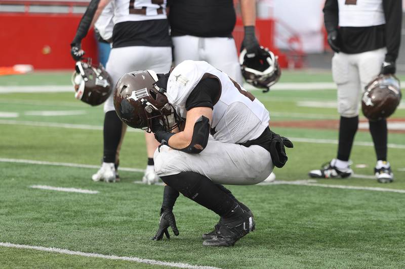 Joliet Catholic’s Nate Magrini stays on the field after losing to Nazareth in the Class 5A state championship on Saturday, Nov. 30, 2024 in Normal.