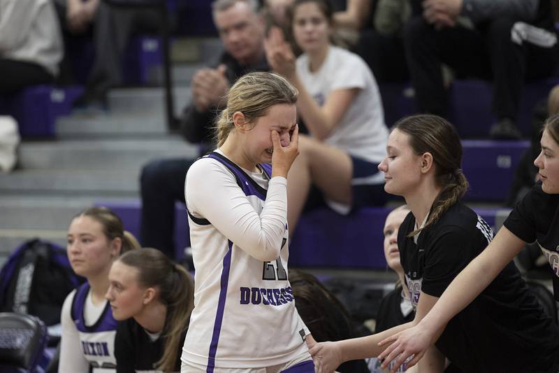 Dixon’s Reese Dambman goes to the bench in the waning seconds of the Duchesses loss to Geneva Thursday, Feb. 19, 2026, in the Class 3A girls basketball regional title game.