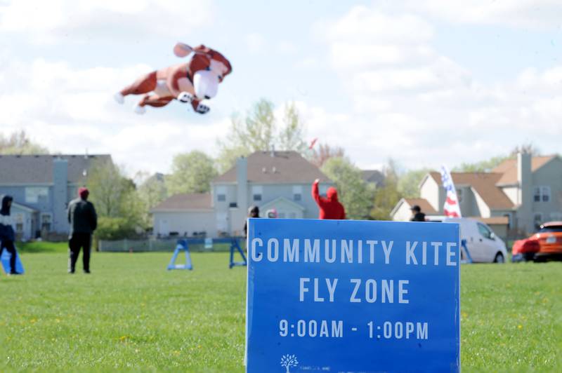 Kite enthusiasts for a celebration of Earth Day and National Kite Month at Prairie Point Park in Oswego, Saturday, April 20, 2024.