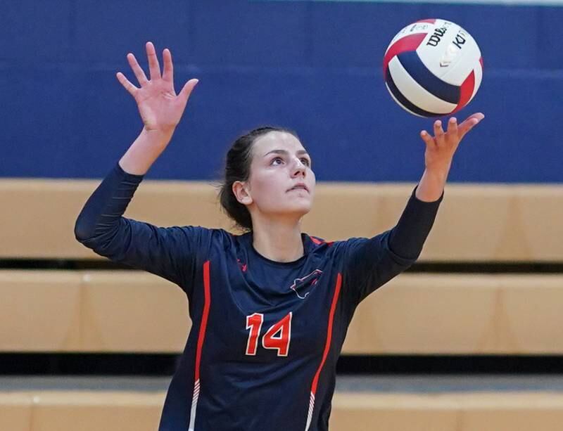 Oswego’s Mia Jurkovic (14) serves the ball against Rosary during a volleyball match at Oswego High School on Tuesday, Aug 29, 2023.