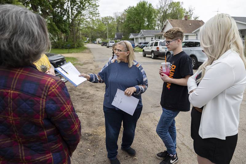 Habitat for Humanity advocate Clara Harris speaks with the family Saturday, May 4, 2024 at the site of the latest home in Dixon.