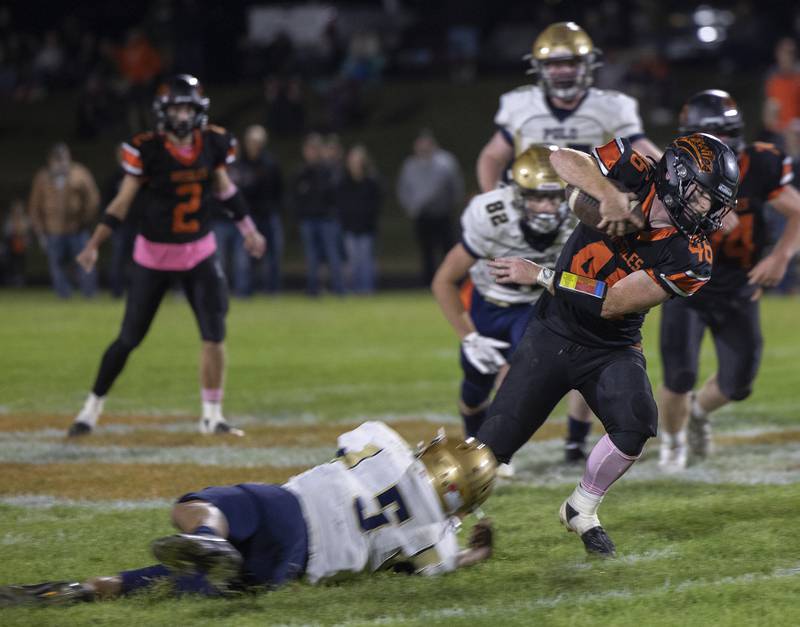 Milledgeville’s Spencer Nye slips a tackle against Polo Friday, Oct. 4, 2024, at Milledgeville High School.