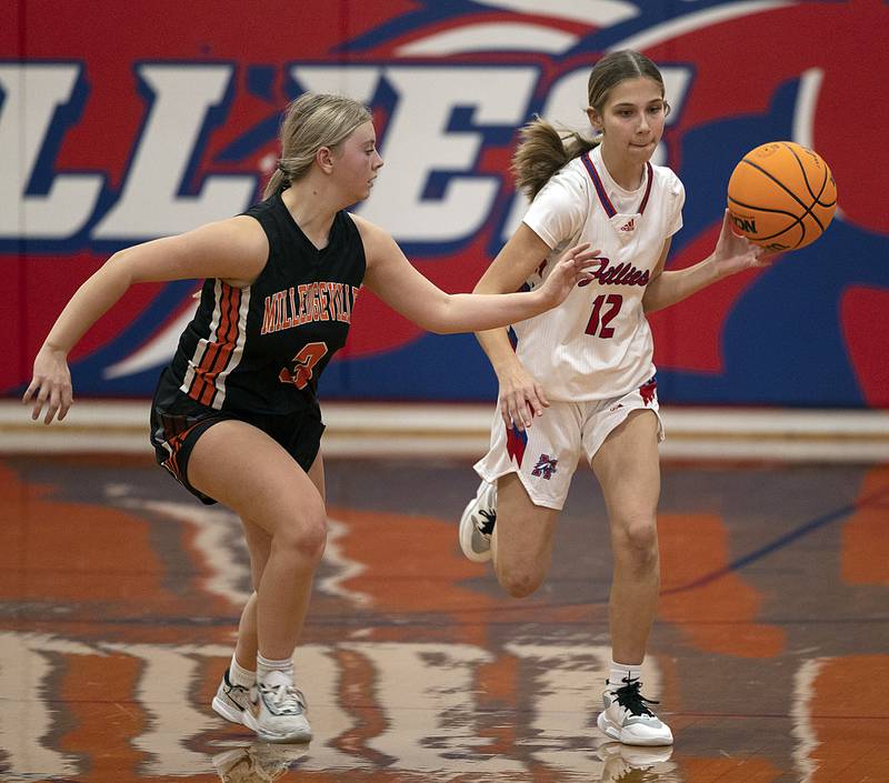 Morrison’s Paisley VanZuiden brings the ball up court against Milledgeville’s Taylor Sarber Wednesday, Jan. 22, 2025.