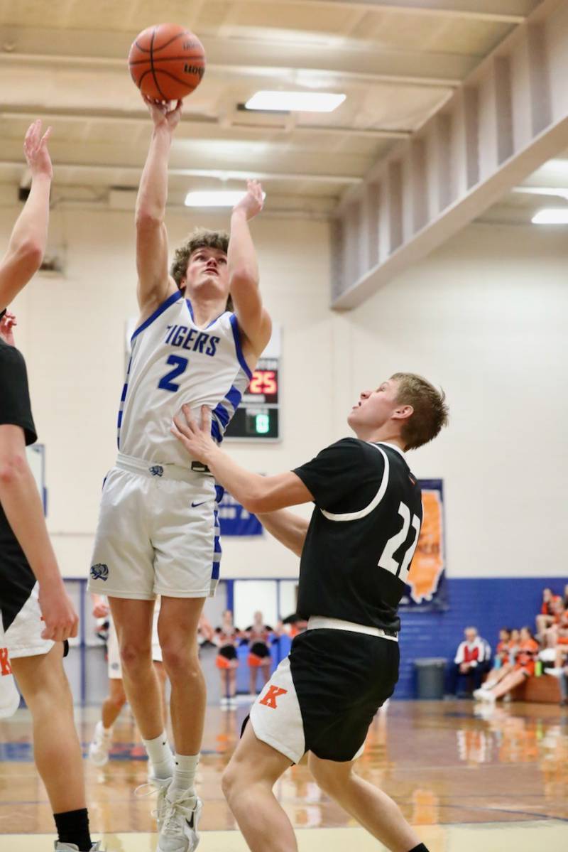 Princeton's Teegan Davis shoots over Kewanee's Jaiden Little Tuesday night at Prouty Gym. The Tigers won 66-44.