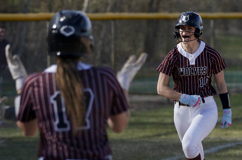 Prairie Ridge's Kylie Carroll celebrates her two-run homer during Fox Valley Conference softball game against Huntley on Monday, April 14, 2025, at Prairie Ridge High School in Crystal Lake.