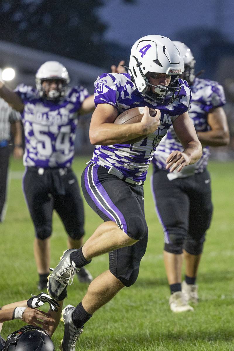 Dixon’s Landon Knigge leaps into the end zone against Rock Falls Friday, Sept. 12, 2025.