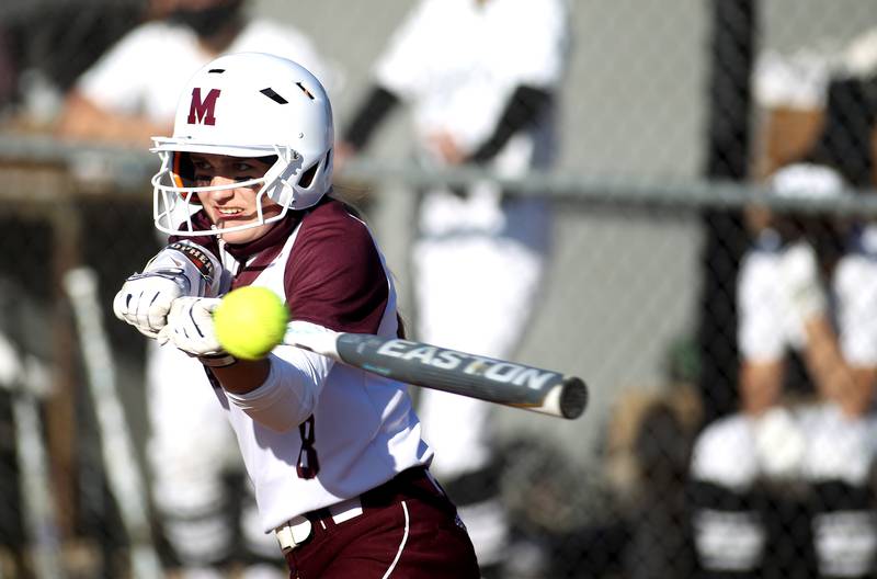 Marengo's Maddy Christopher makes contact during a game at Kaneland on Monday, April 12, 2021.