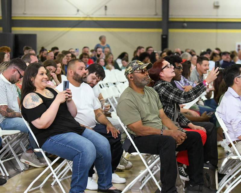Loved ones video record Sycamore High School senior graduates receiving their diplomas on Sunday, May 25, 2025, during the Class of 2025 Commencement ceremony at the high school.