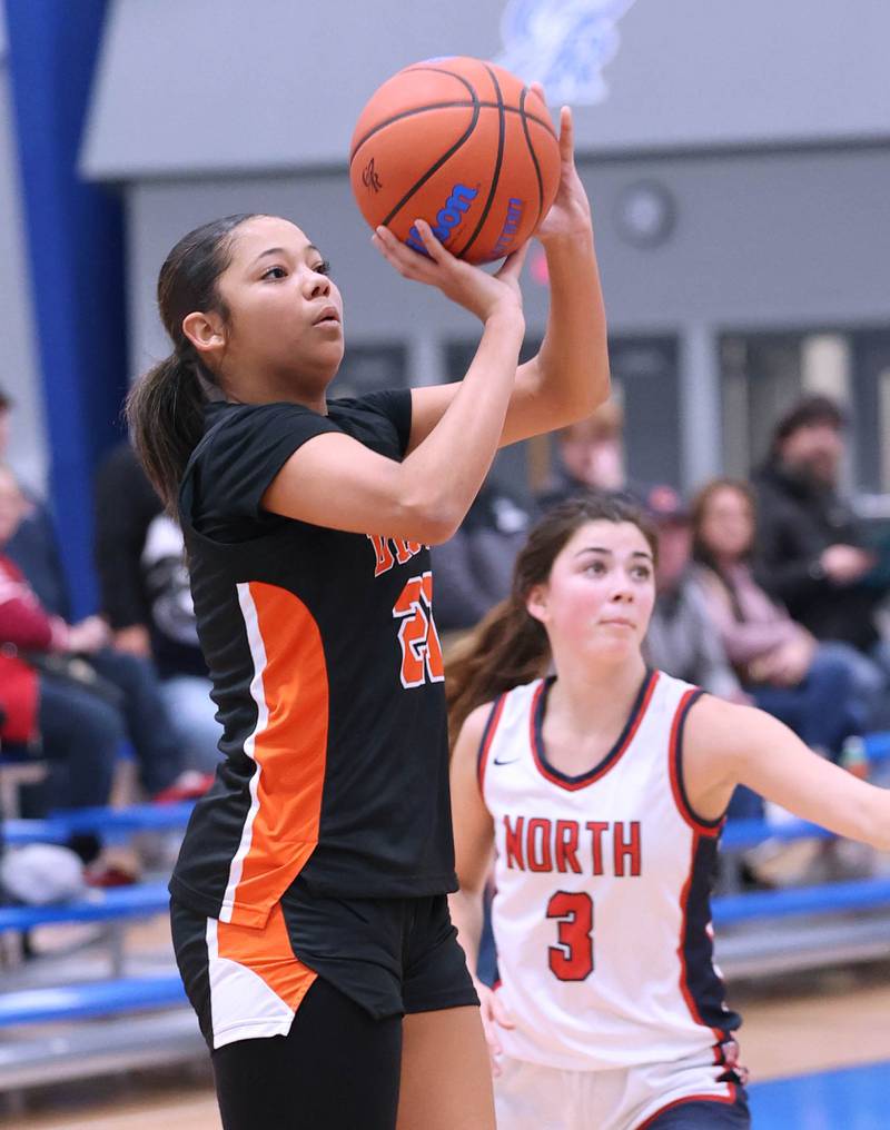 DeKalb’s Alicia Johnson shoots the ball in front of Belvidere North's Ava Armstrong during their game Friday, Nov. 17, 2023, in the Mark Einwich Varsity Girls Basketball Rockets Kickoff Tournament at Burlington Central High School.