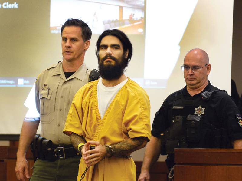 Johnathon Gounaris is escorted into a courtroom on Wednesday, July 10, 2024 for a preliminary hearing at the Ogle County Judicial Center in Oregon. He is charged with attempted murder following a June 12 incident at a Lost Lake home in rural Dixon where three police officers were shot.