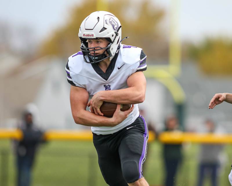 Dixon's Landon Knigge (4) runs with the ball during Class 4A quarterfinal football game between Dixon at Coal City on Saturday, Nov 16, 2024  in Coal City.