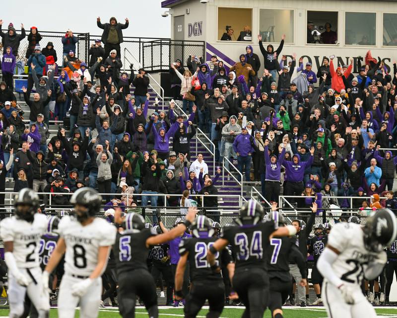 Downers Grove North fans cheer after winning the second week class 7A game over Fenwick from a field goal in the last seconds of the game on Saturday Nov. 9, 2024, held at Downers Grove North High School.