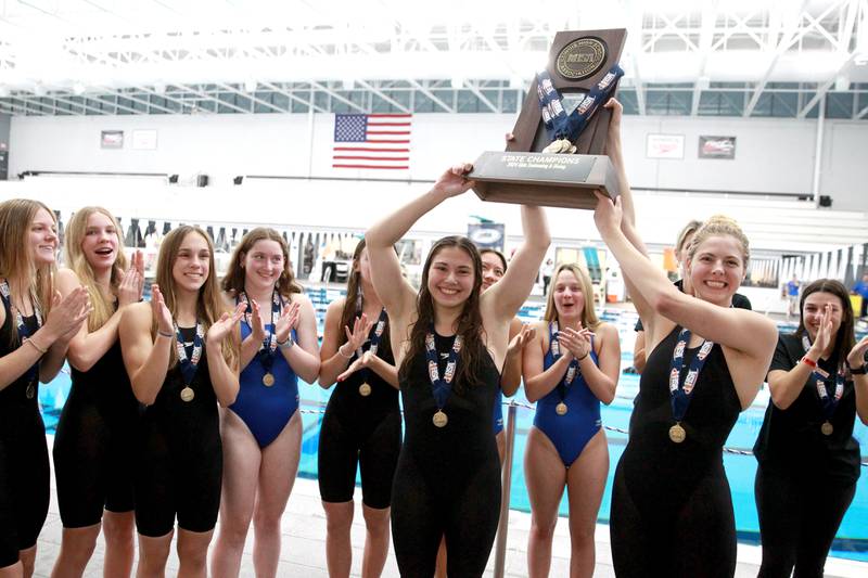Rosary swimmers celebrate their first place win in the IHSA Girls State Championships on Saturday, Nov. 16, 2024 at FMC Natatorium in Westmont.