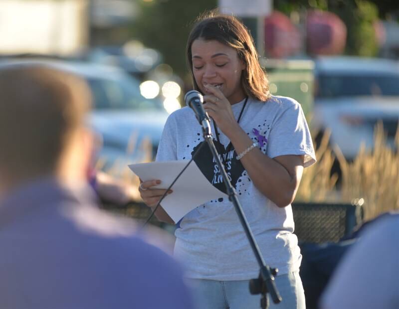 Lauren Metzler, 34, of Rock Falls, tears up as she speaks about her brother, Tevin Shae Rumley, during a Sauk Valley Voices of Recovery Overdose Awareness event in Dixon on Thursday, Aug. 31, 2023. Metzler said her brother, who was 28, died from fentanyl poisoning in 2020 after becoming addicted following a foot injury in college.