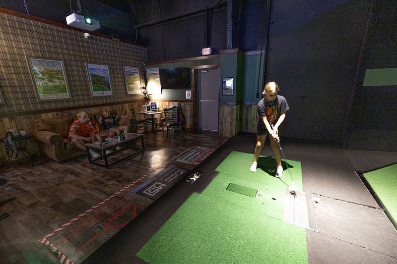 Adyson Miller, 11, of Milledgeville putts at X-Golf Sauk Valley Thursday, August 7, 2025.