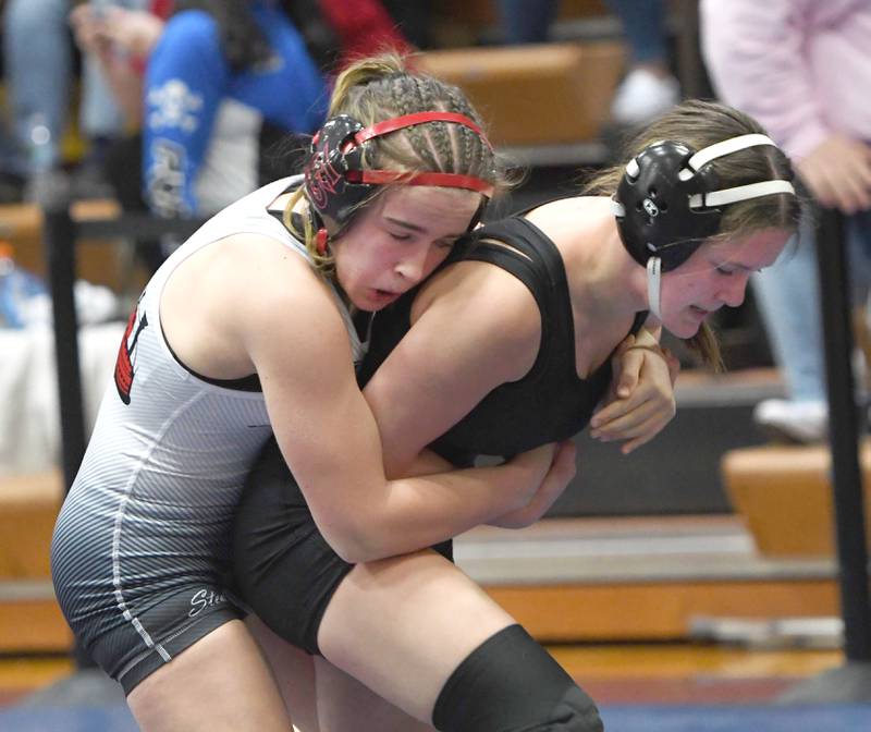 Fulton's Tessa Fosdick holds Byron's Rylie Dach during their 115-pound championship match at the Belvidere Regional on Saturday, Feb. 7, 2026. Fosdick won the match.
