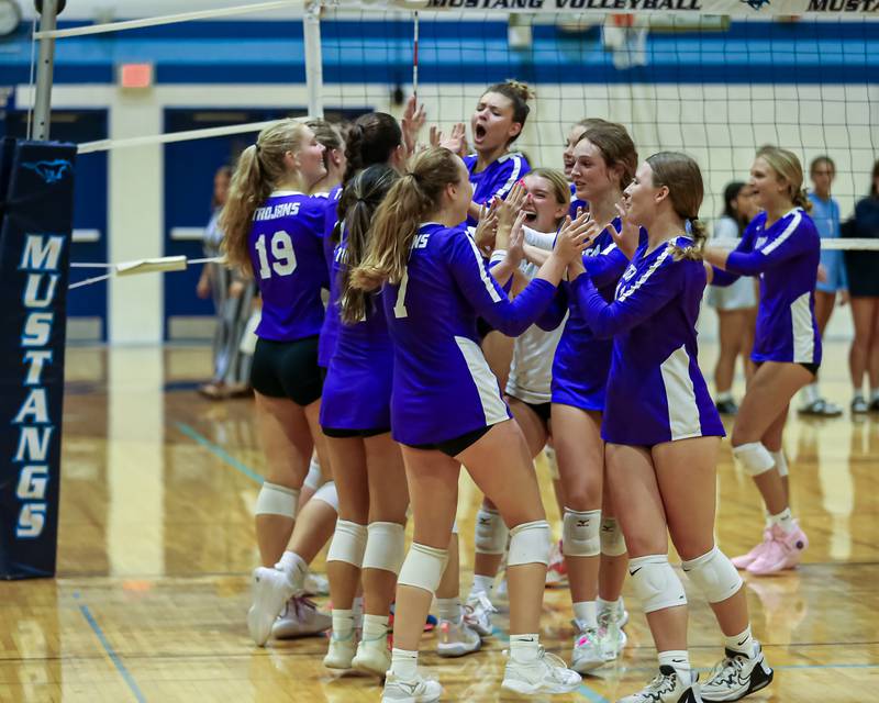 Downers Grove North celebrate the victory over Downers Grove South in their volleyball.  Sept 7, 2023.