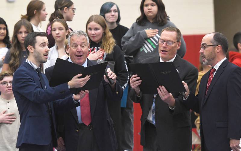 Zach Hall, Mark Tremble, Miles Beske and Andy Eckardt sing during the Oregon School District's Veterans Day Assembly on Tuesday, Nov. 11, 2025. The event was held Tuesday morning in the Blackhawk Center to thank veterans for their service.
