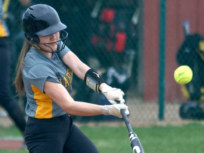 Harvard’s Ytzel Lopez makes contact in varsity softball at Marengo Thursday.