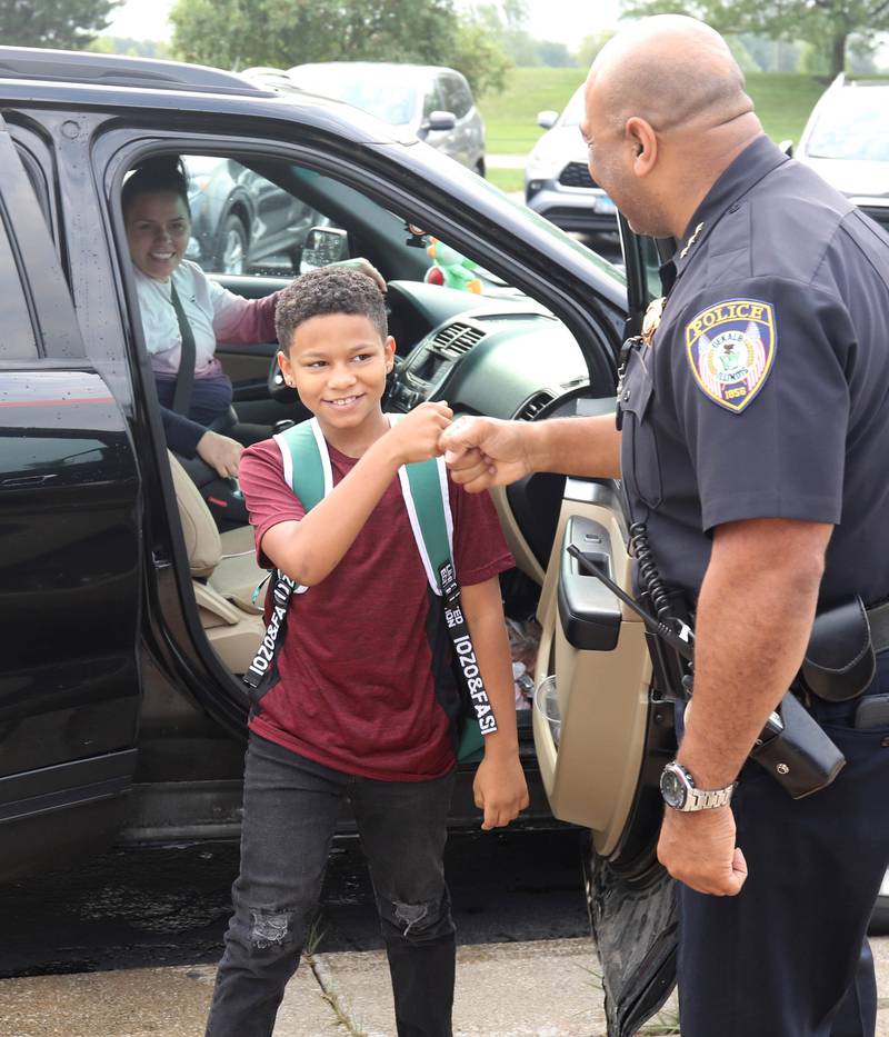 DeKalb Police Chief David Byrd greets students Thursday, Aug. 17, 2023, as they arrive for the first day of the new school year at Gwendolyn Brooks Elementary School in DeKalb.