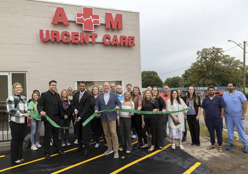 Dr. Ashok Maini (center) cuts the ribbon Friday for A.M. Urgent Care in Rock Falls. The facility is located at 1201 First Ave.