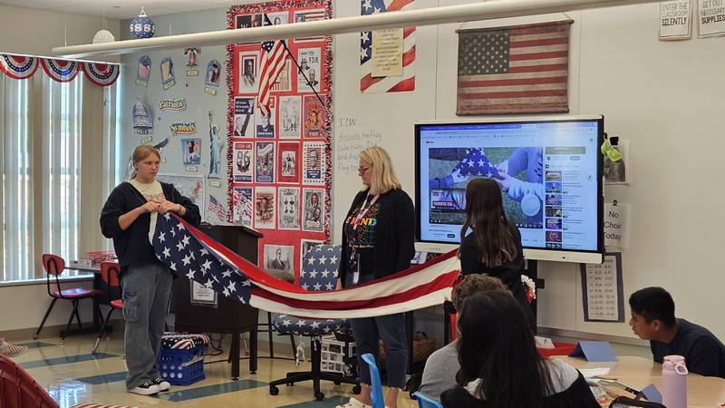 Morris Grade School eighth-grade teacher Amy Lindenborn teaches the U.S. flag code as part of her history, social studies and civics course. 2025