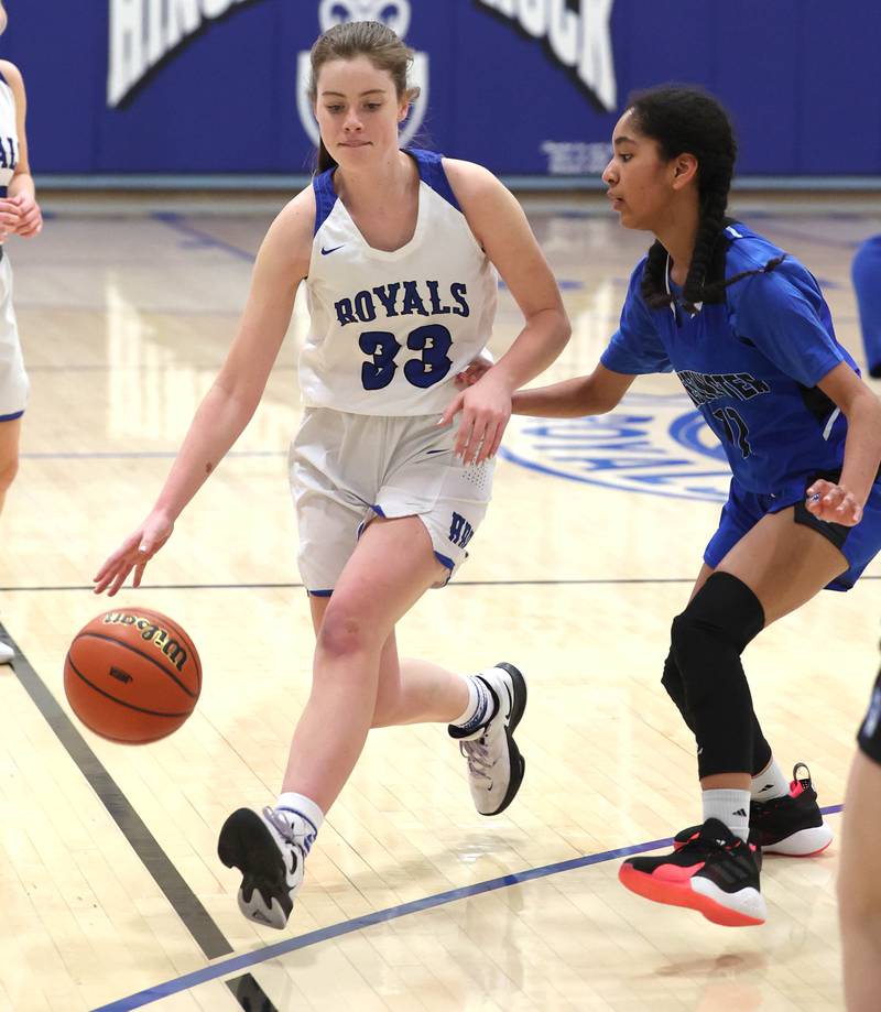 Hinckley-Big Rock's Alyssa Swanson dribbles the ball by Westminster Christian's Beyah Richardson during their regional semifinal game Monday, Feb. 13, 2023, at Hinckley-Big Rock High School.