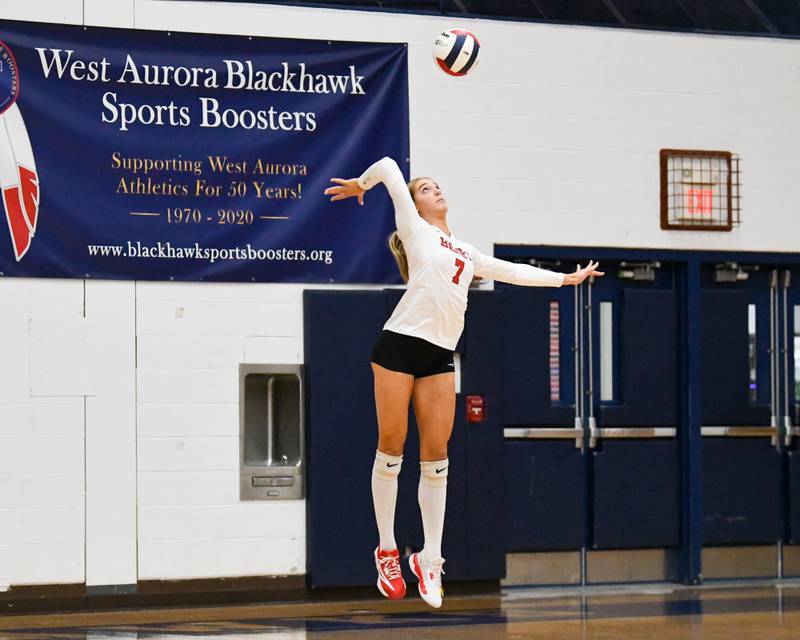 Benet Academy's Audrey Asleson (7) serves the ball during the first of two games on Thursday Nov. 7, 2024, while taking on St. Charles North at West Aurora 4A sectional championship match up.