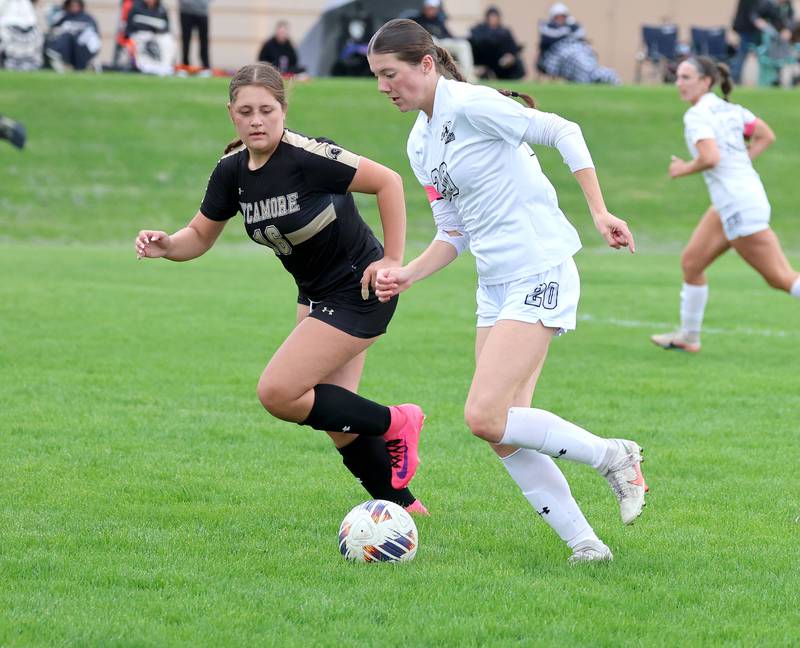 Kaneland's Erin Doucette pushes the ball past Sycamore's Charlotte Yates during their game Wednesday, April 29, 2026, at Sycamore High School.