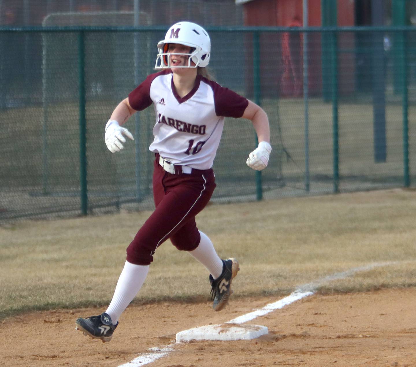 Marengo’s Lilly Kunzer rounds the bases after a home run during a win over Belvidere in varsity softball at Marengo on Monday.