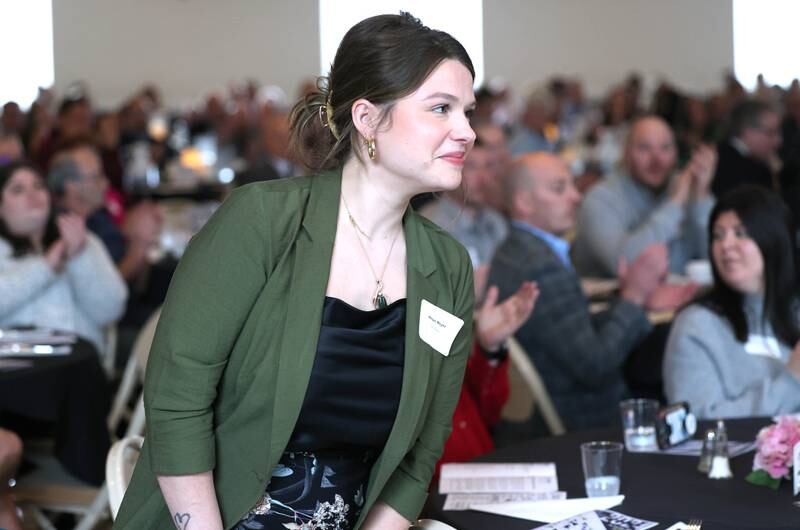 Megan Meyer, of MC Beauty, is introduced as her business is awarded the Community Diamond Award during the 107th Annual Sycamore Chamber of Commerce Meeting Thursday, March 7, 2023, in Memorial Hall at St. Mary's Catholic Church in Sycamore.