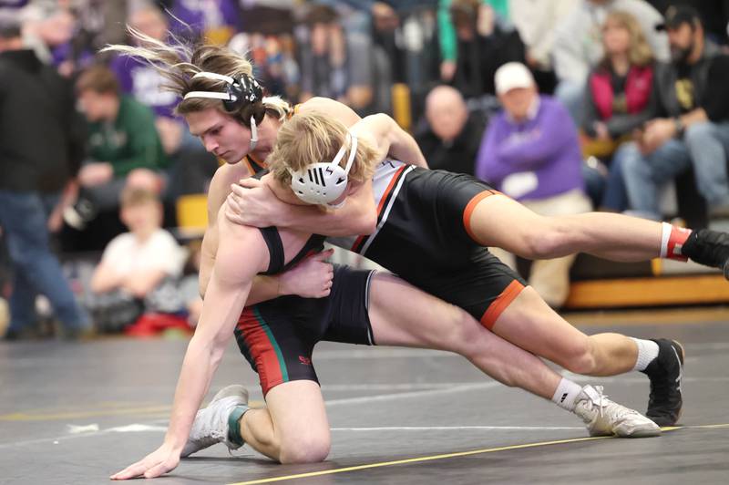 Sandwich’s Miles Corder takes down LaSalle-Peru’s Gunnar Skoog in their 138 pound match Saturday Jan. 21, 2023, during the Interstate 8 Conference wrestling tournament at Sycamore High School.