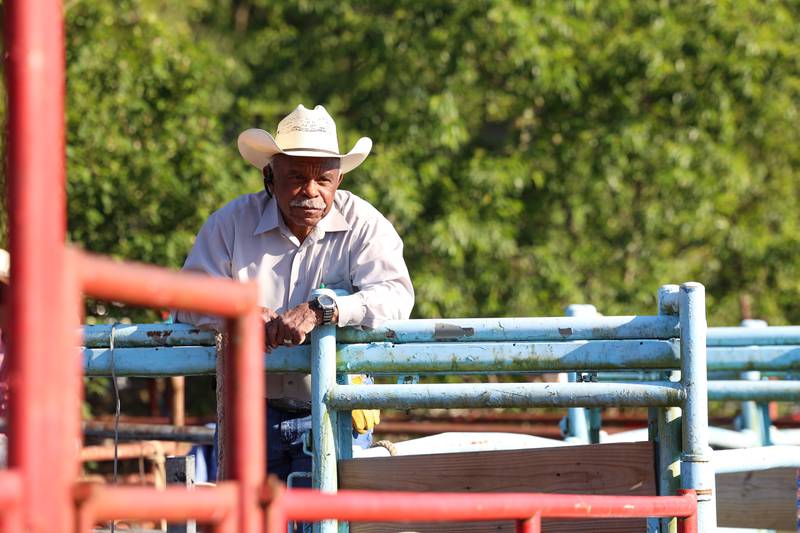 Mike Latting, owner of Latting Rodeo Productions, sits atop the bullpen area during the 50th Pembroke Rodeo on Sunday, May 24, 2026.