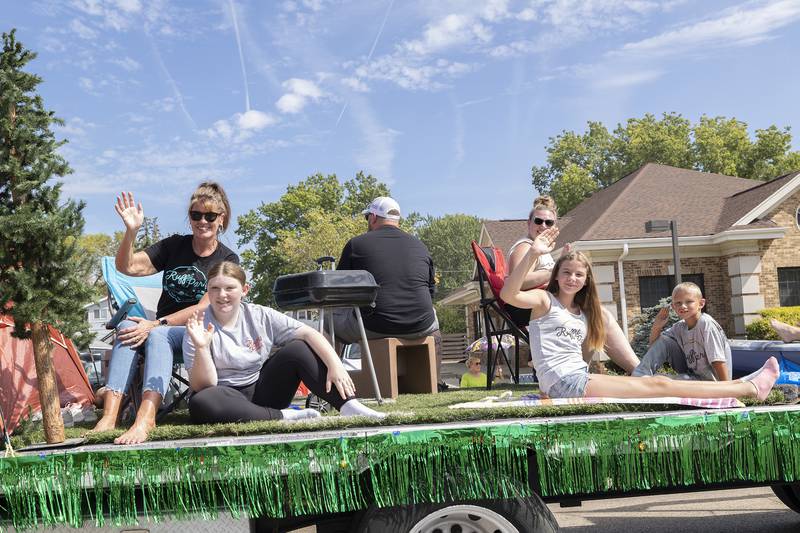 Ruffit Park campground representatives wave from their Fiesta Days parade float Saturday, Sept. 14, 2024.