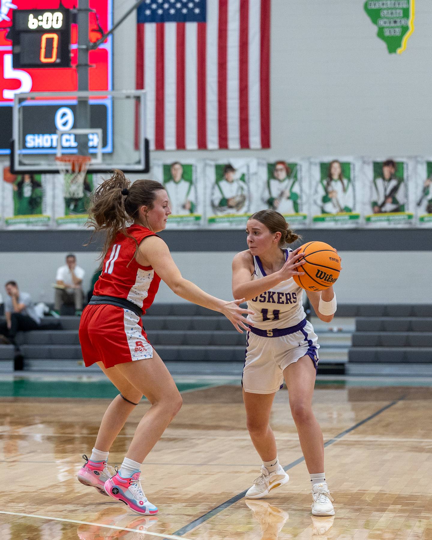 Sage Mahler (11) of Serena holds ball as Ava Gwaltney (11) of Streator defends in a game earlier this season at Seneca High School in Seneca.