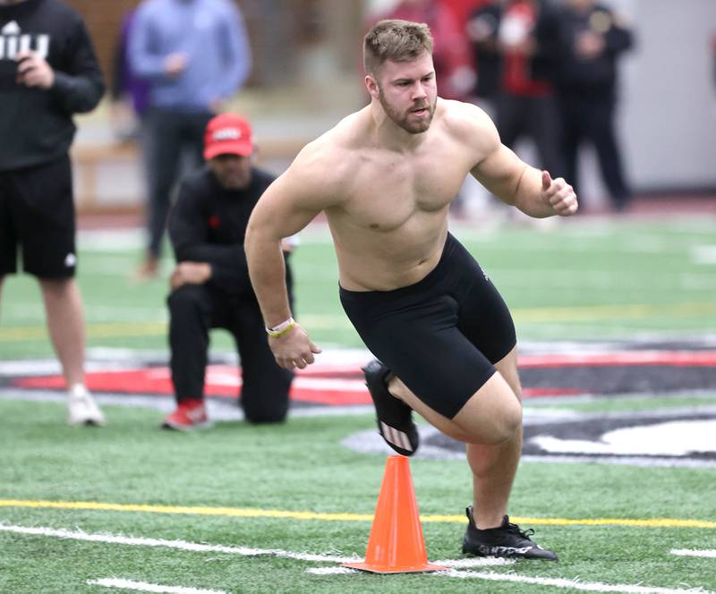 Former Northern Illinois University running back Clint Ratkovich works through a drill Wednesday, March 30, 2022, during pro day in the Chessick Practice Center at NIU. Several NFL teams had scouts on hand to evaluate the players ahead of the upcoming draft.