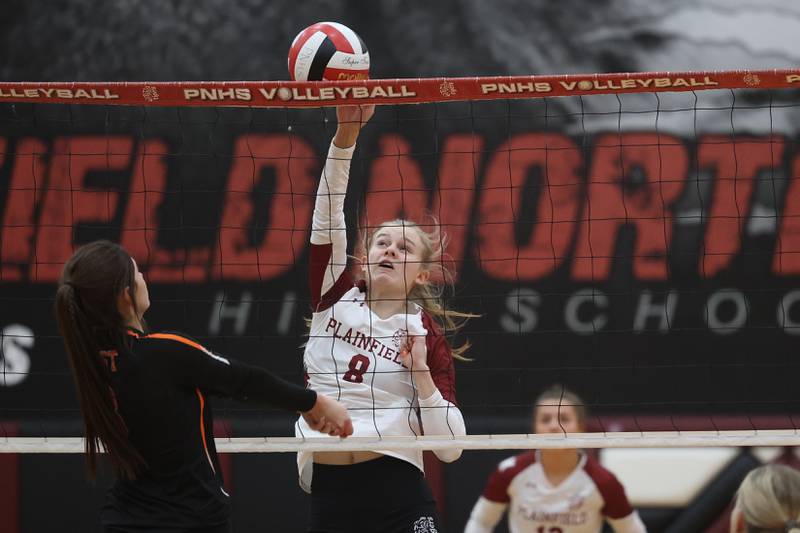 Plainfield North’s Sydney Pavlik pushes over a shot against Plainfield East on Thursday night.