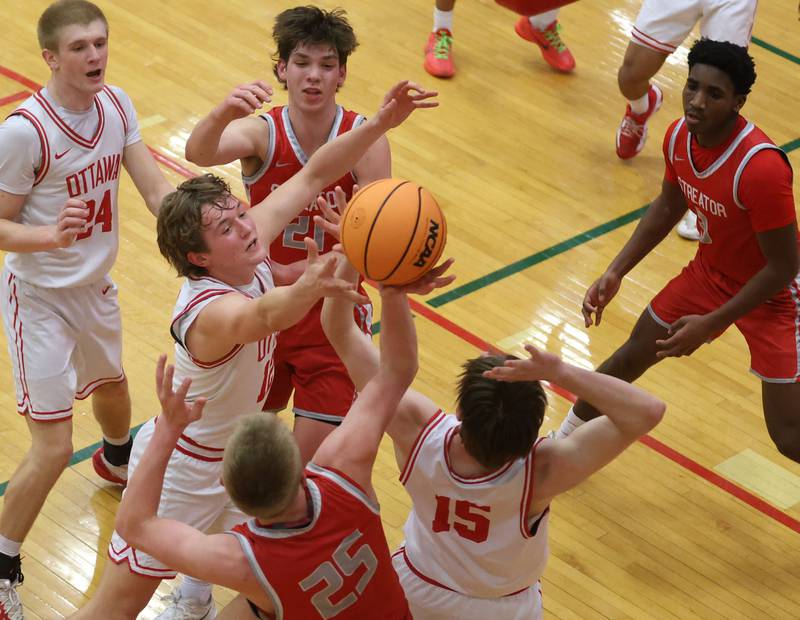 The ball is batted around in the lane by Ottawa and Streator during the Class 3A Regional semifinal game on Wednesday, Feb. 25, 2026 in Sellett Gymnasium at L-P High School.