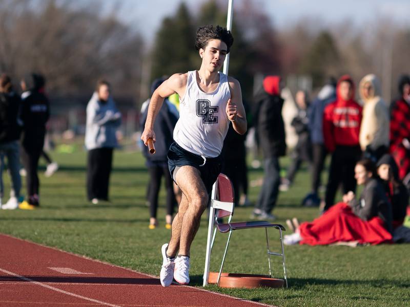 Oswego East’s Noel Velasquez competes in the 4 x 800 meter relay race during the Matt Wulf Invitational track and field meet at Yorkville High School on Thursday, April 14, 2022.